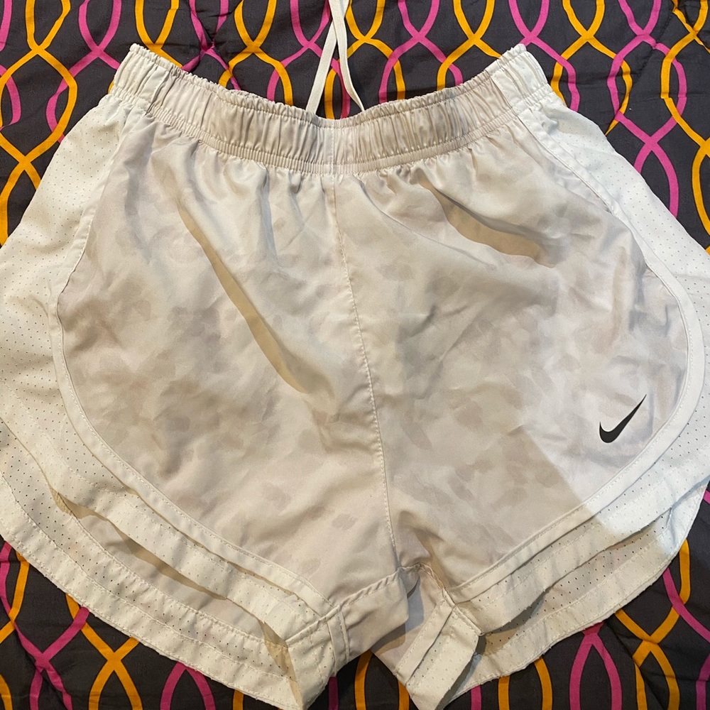white nike athletic shorts with light grey pattern